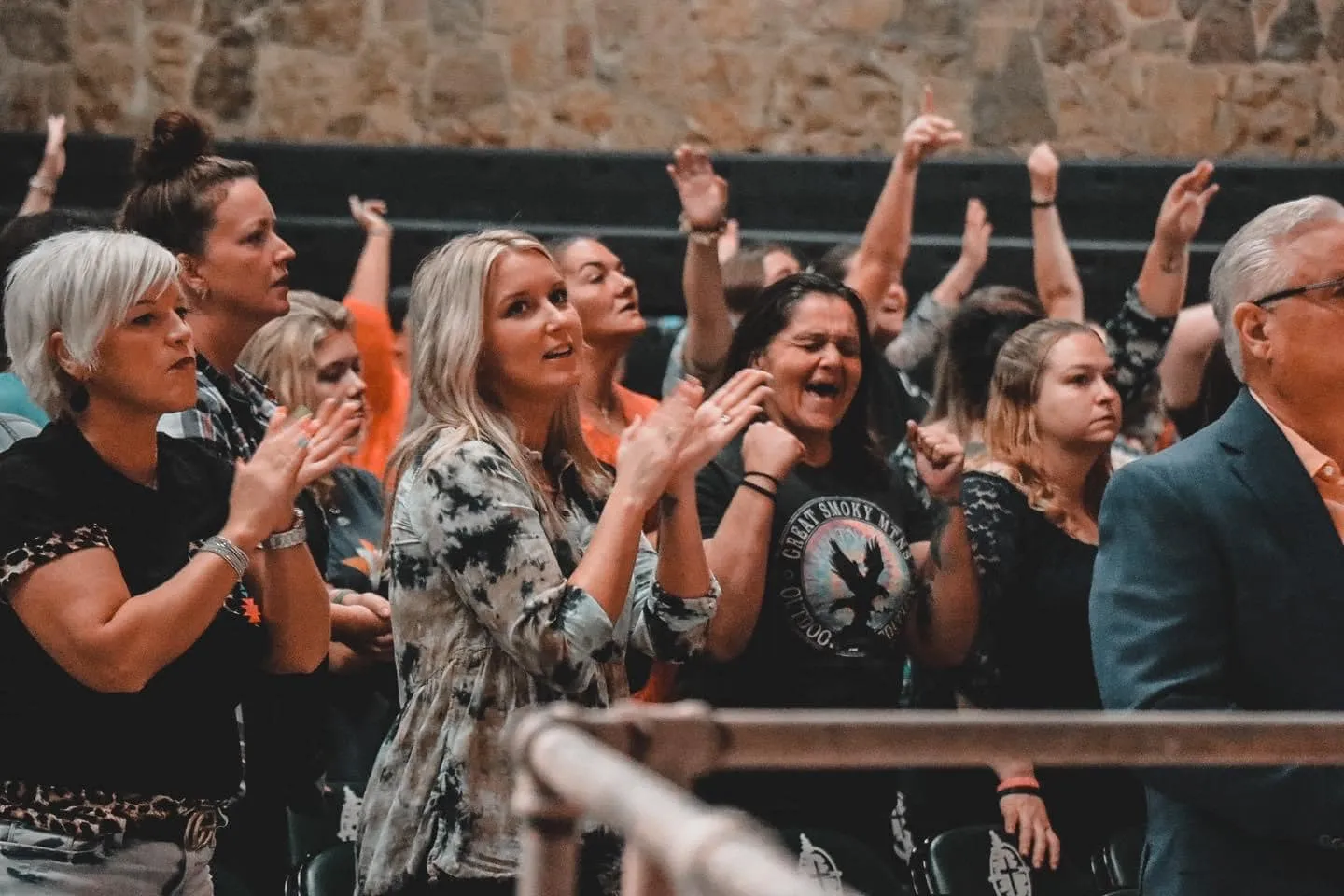 Women worshipping and praising together during a service