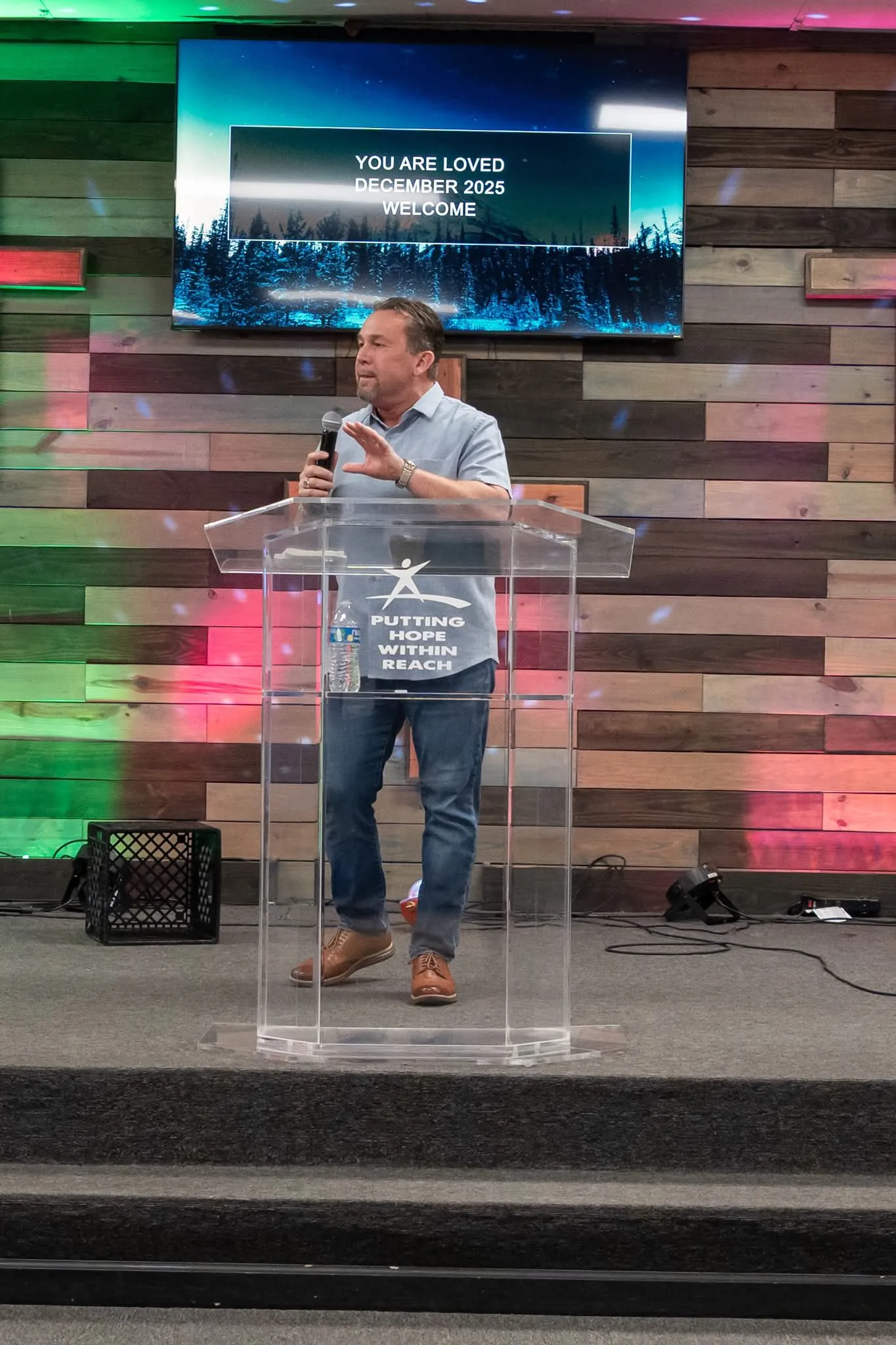 Jeff preaching at the pulpit — Putting Hope Within Reach
